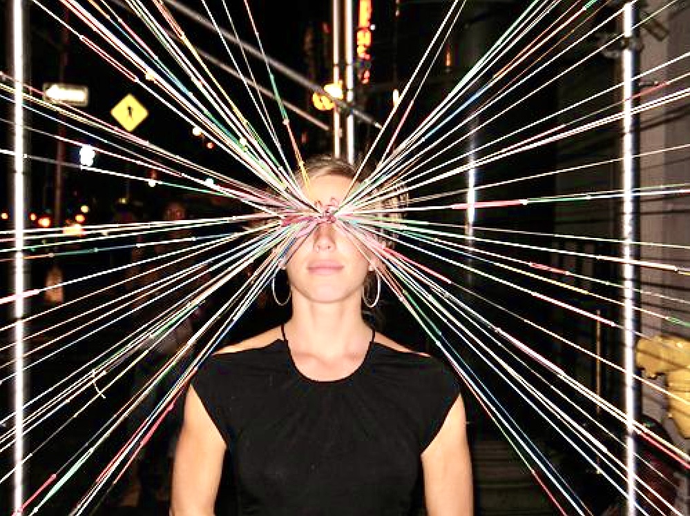 Portrait of Jasmine at the center of a radiating rainbow string web